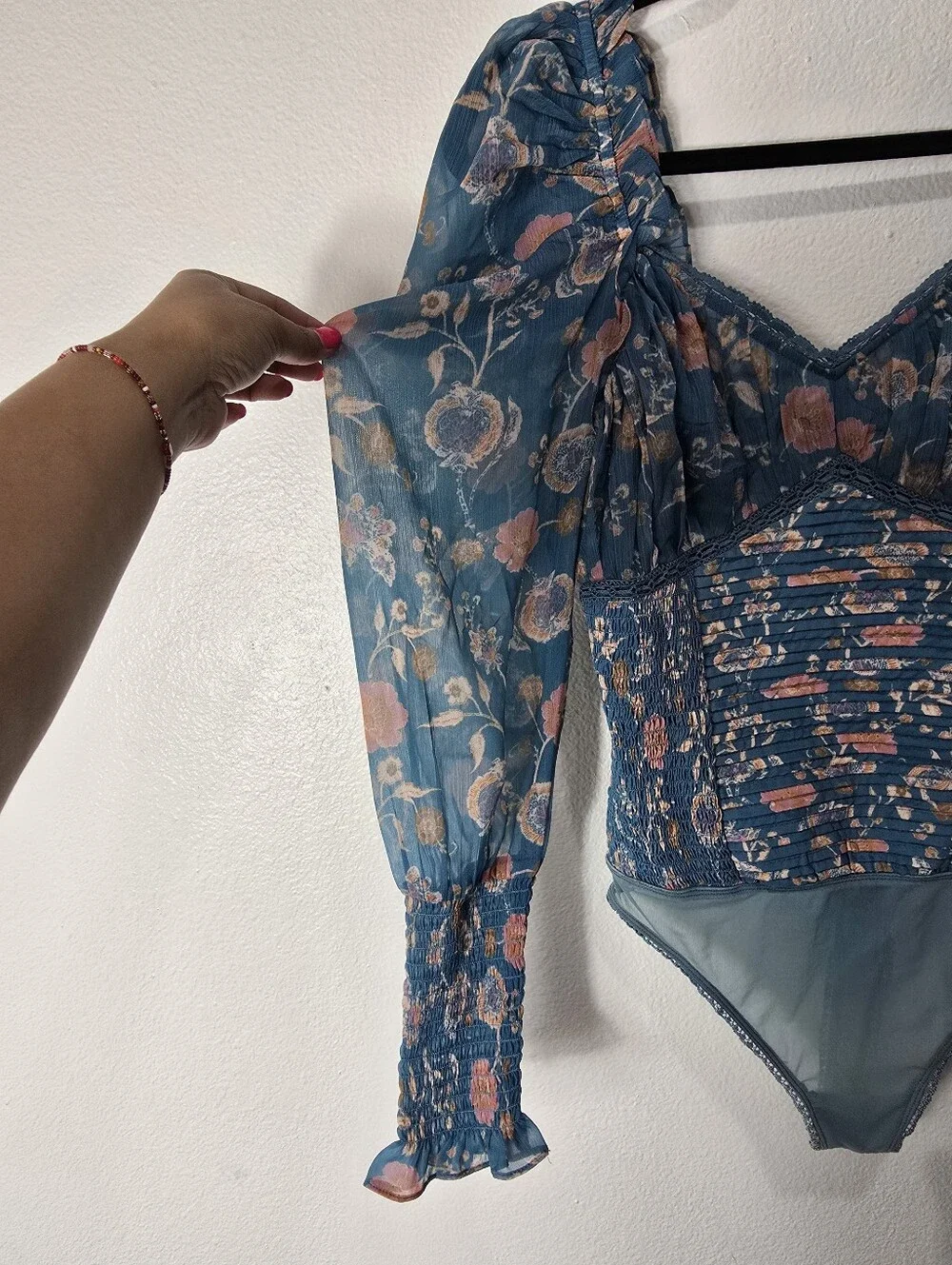 Free People Turquoise Floral Smocked  Long Sleeve Bodysuit.